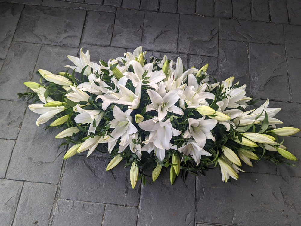 white lily casket spray