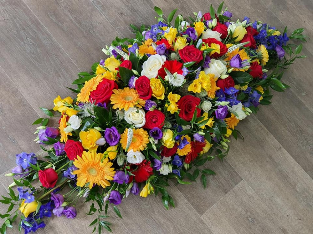 vibrant casket spray